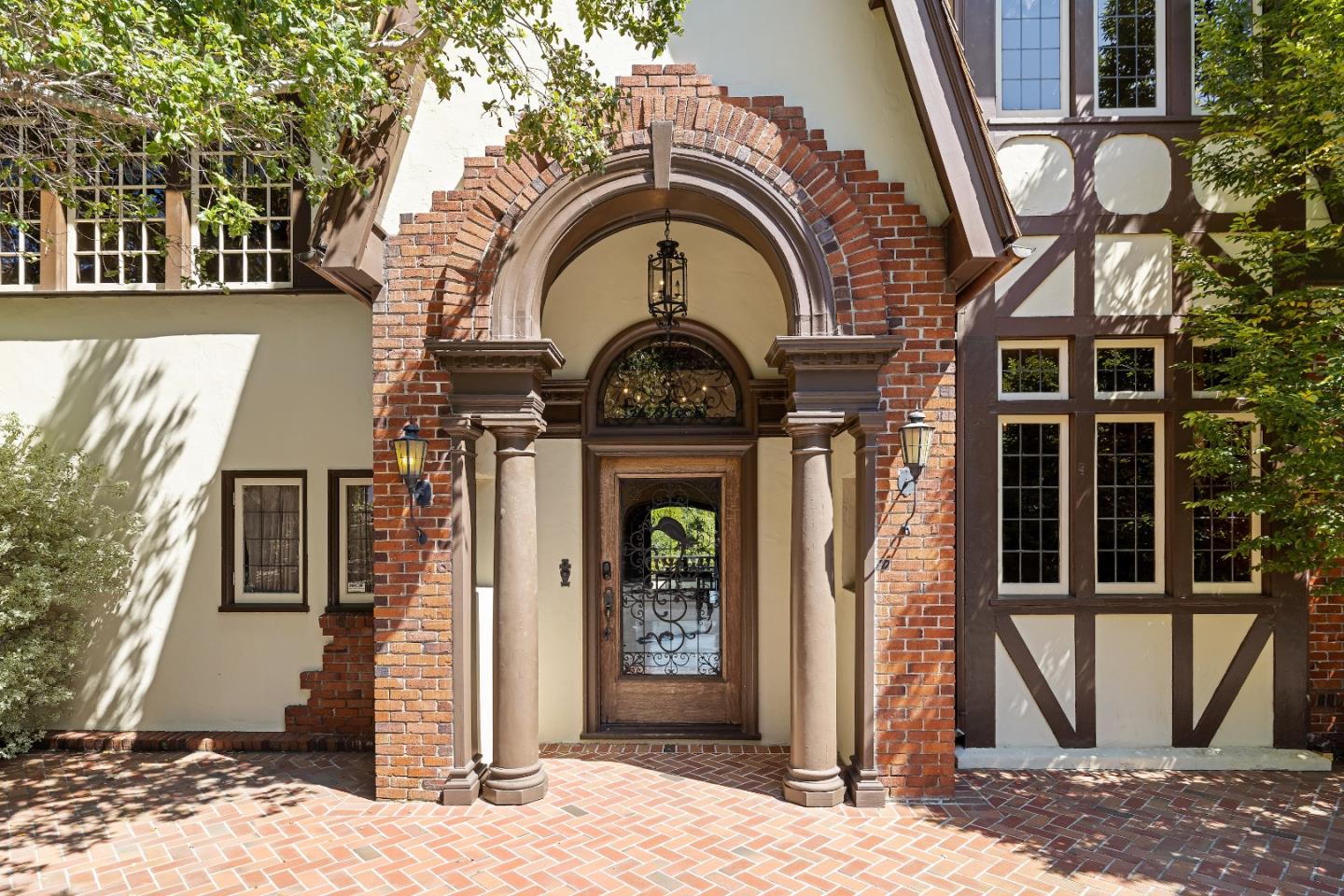 446 El Arroyo Road Hillsborough, CA 94010 - Photo 4 of 32 a front view of a house with garden