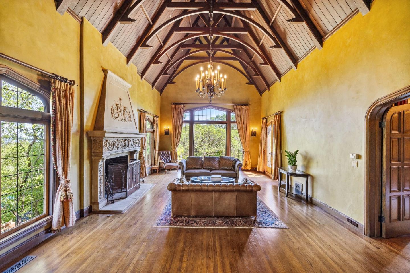 446 El Arroyo Road Hillsborough, CA 94010 - Photo 7 of 32 a living room with furniture fireplace and flat screen tv