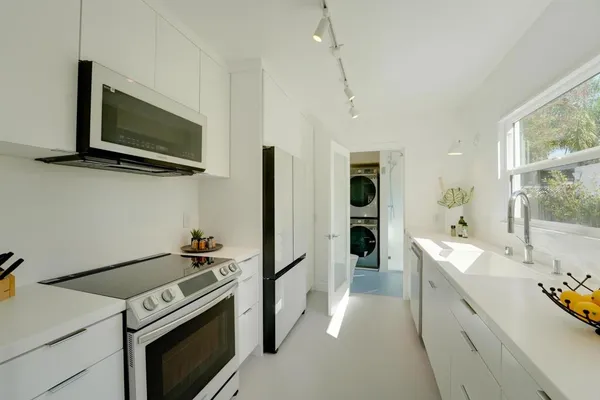 a kitchen with a stove and a microwave