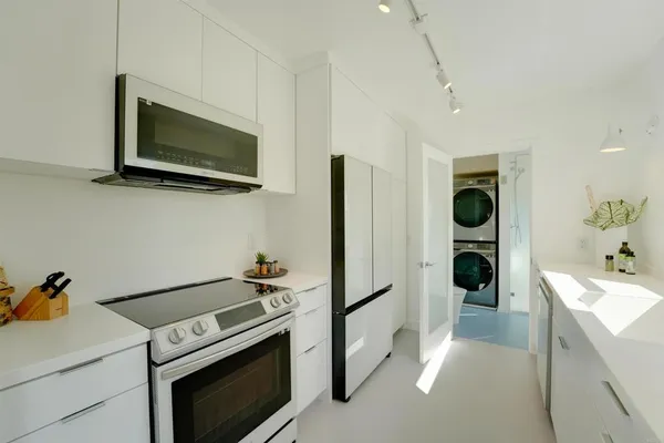 a kitchen with a stove and a microwave