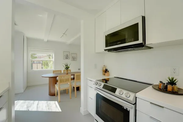 a kitchen with a stove and a microwave