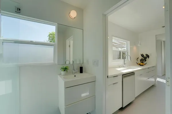 a bathroom with a sink and a mirror