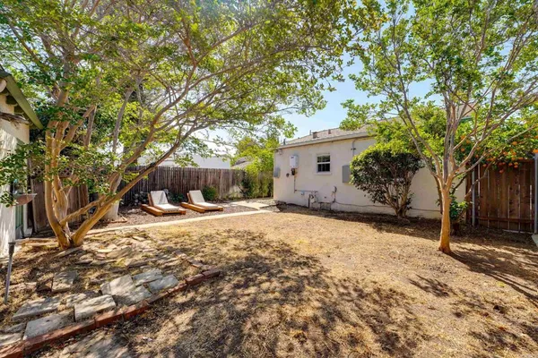 a view of a house with a tree