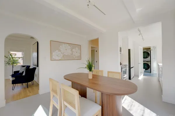 a view of a dining room with furniture and wooden floor