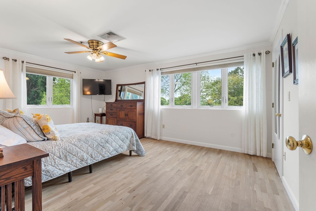 36 Dunham Road, Unit 109 Beverly, MA 01915 - Photo 11 of 22 a bedroom with a bed dresser and a window