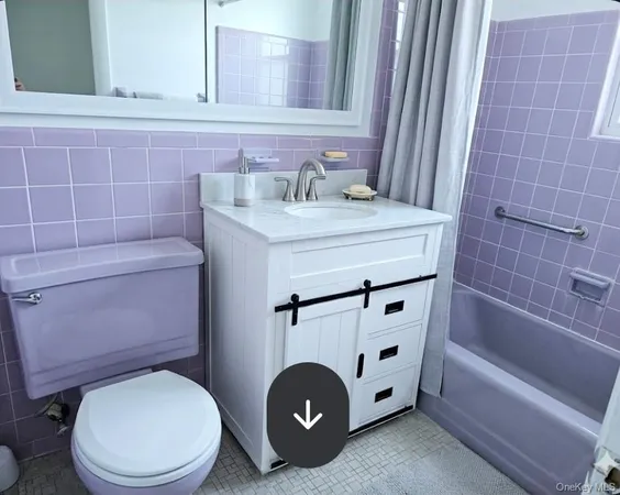 a bathroom with a sink a toilet and bathtub