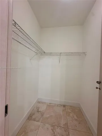 an aerial view of a house with a lake view