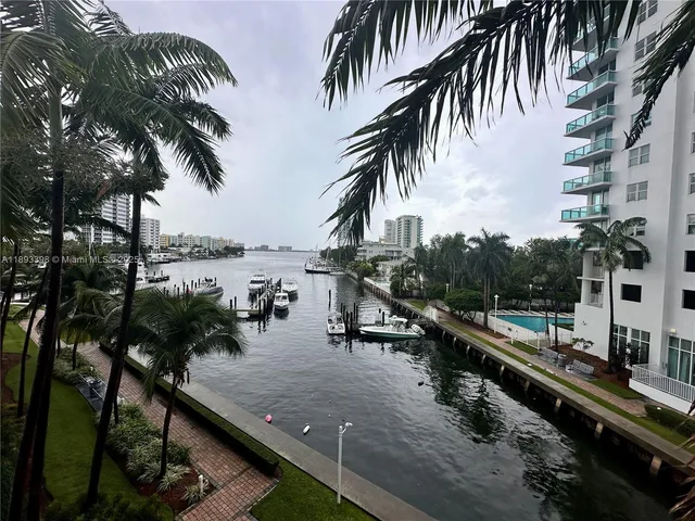 a view of a city with palm trees