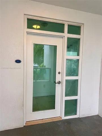a view of an empty room with a fireplace