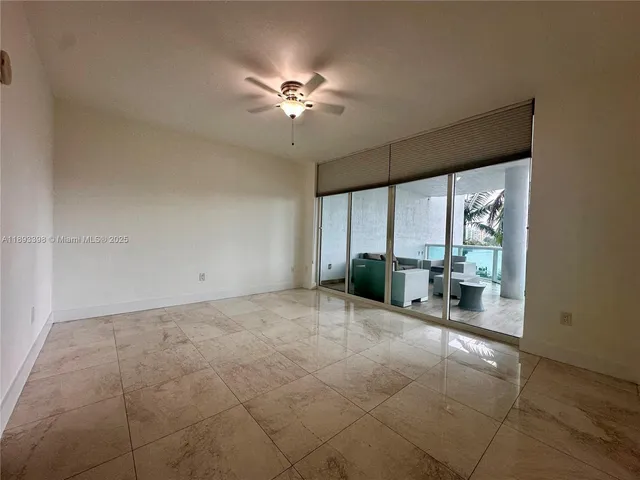 a spacious bathroom with a bathtub shower sink mirror and toilet