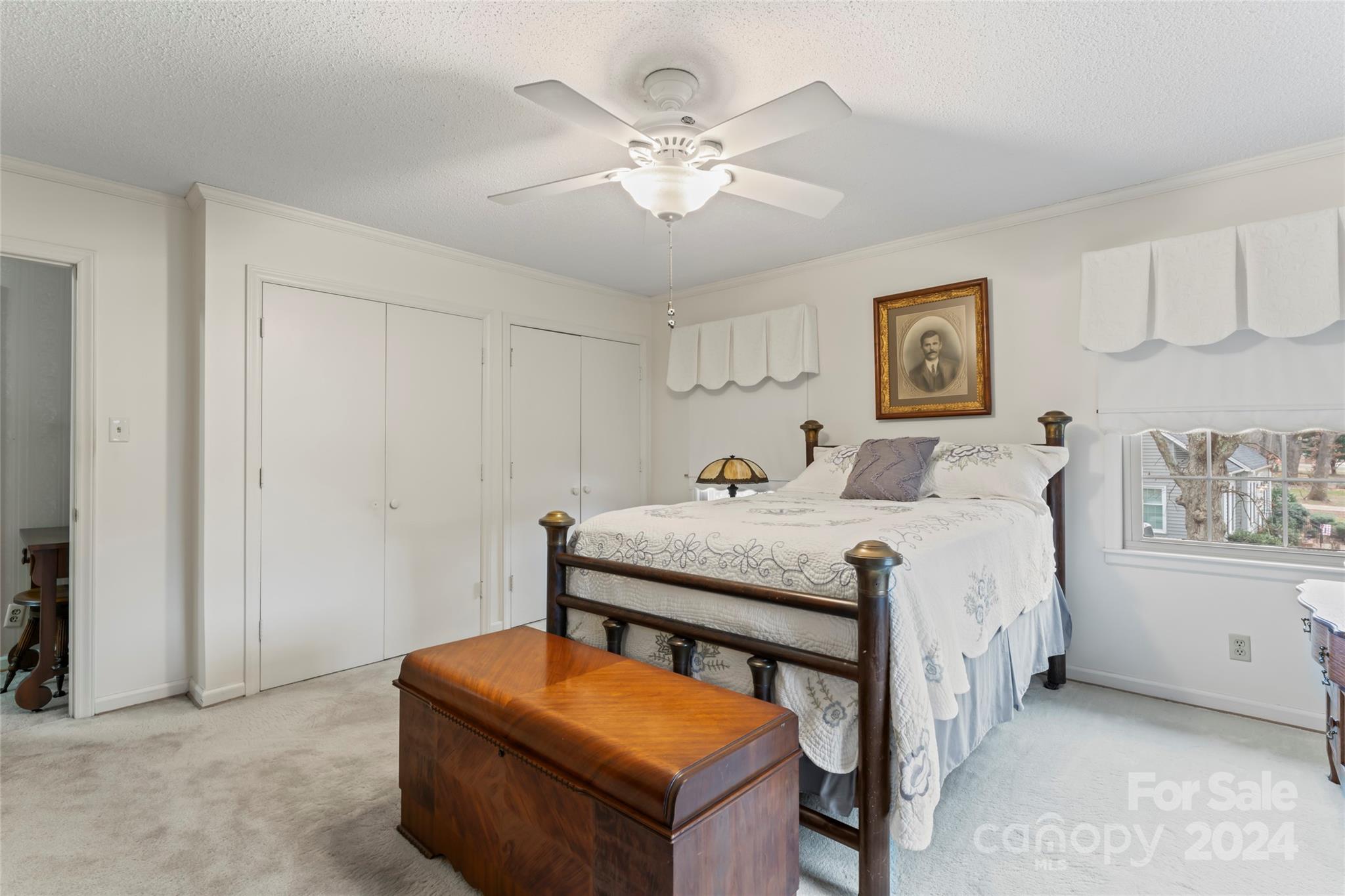 950 Arrowhead Drive Rock Hill, SC 29730 - Photo 19 of 38 a bedroom with a bed and a chandelier