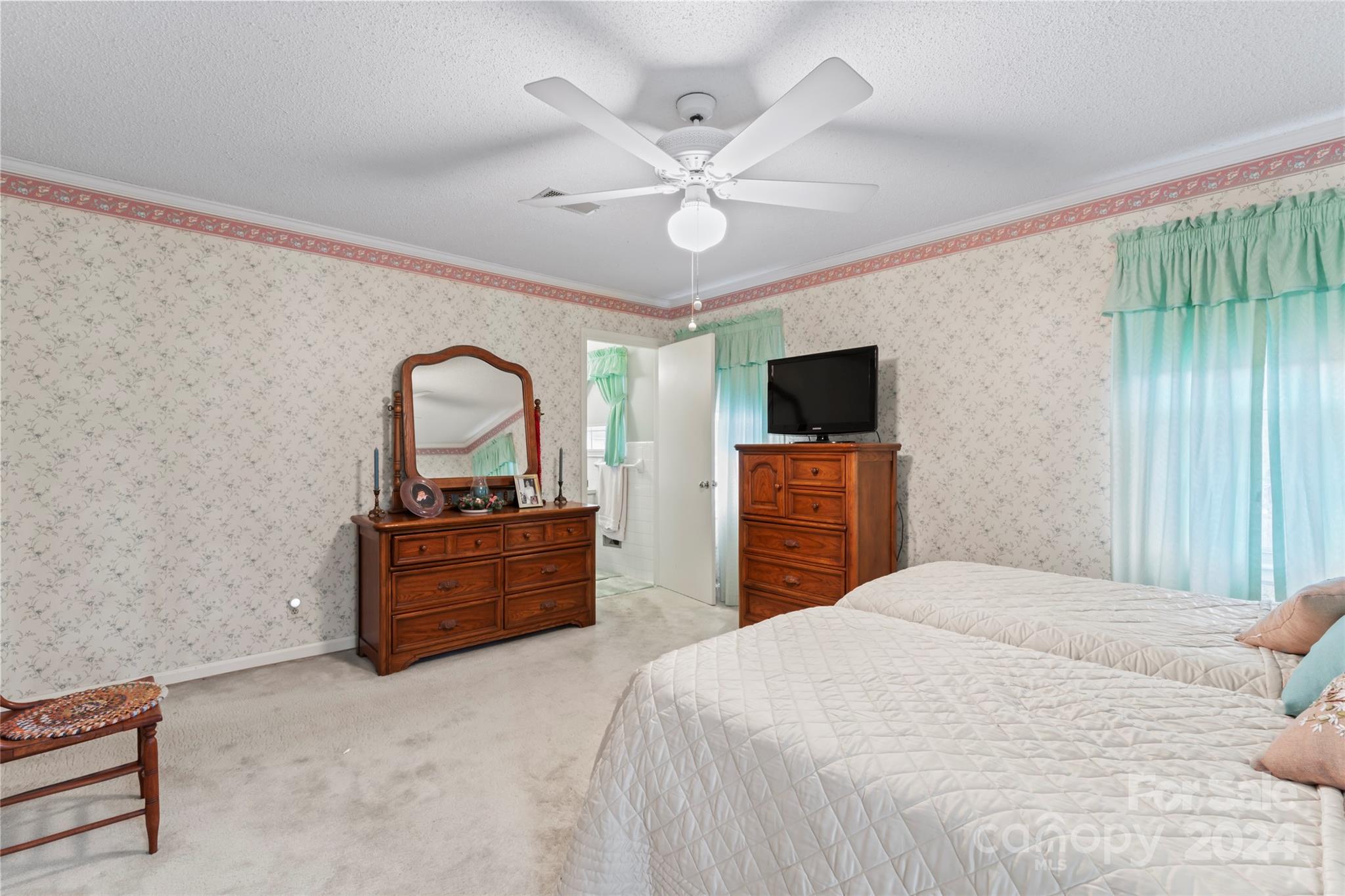 950 Arrowhead Drive Rock Hill, SC 29730 - Photo 30 of 38 a bedroom with a bed and a flat screen tv