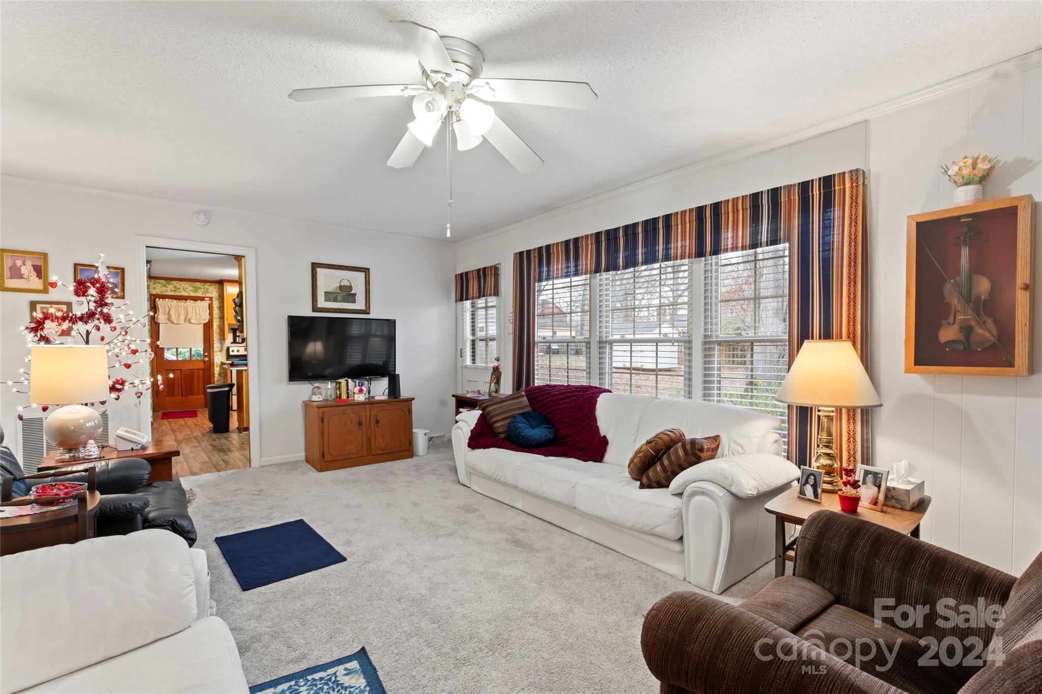 950 Arrowhead Drive Rock Hill, SC 29730 - Photo 9 of 38 a living room with furniture and a flat screen tv