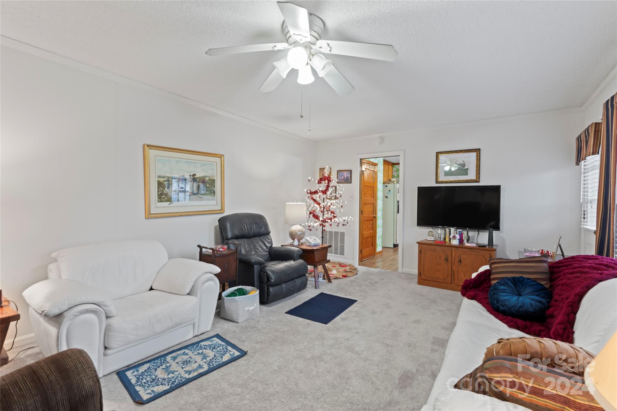 950 Arrowhead Drive Rock Hill, SC 29730 - Photo 10 of 38 a living room with furniture and a flat screen tv