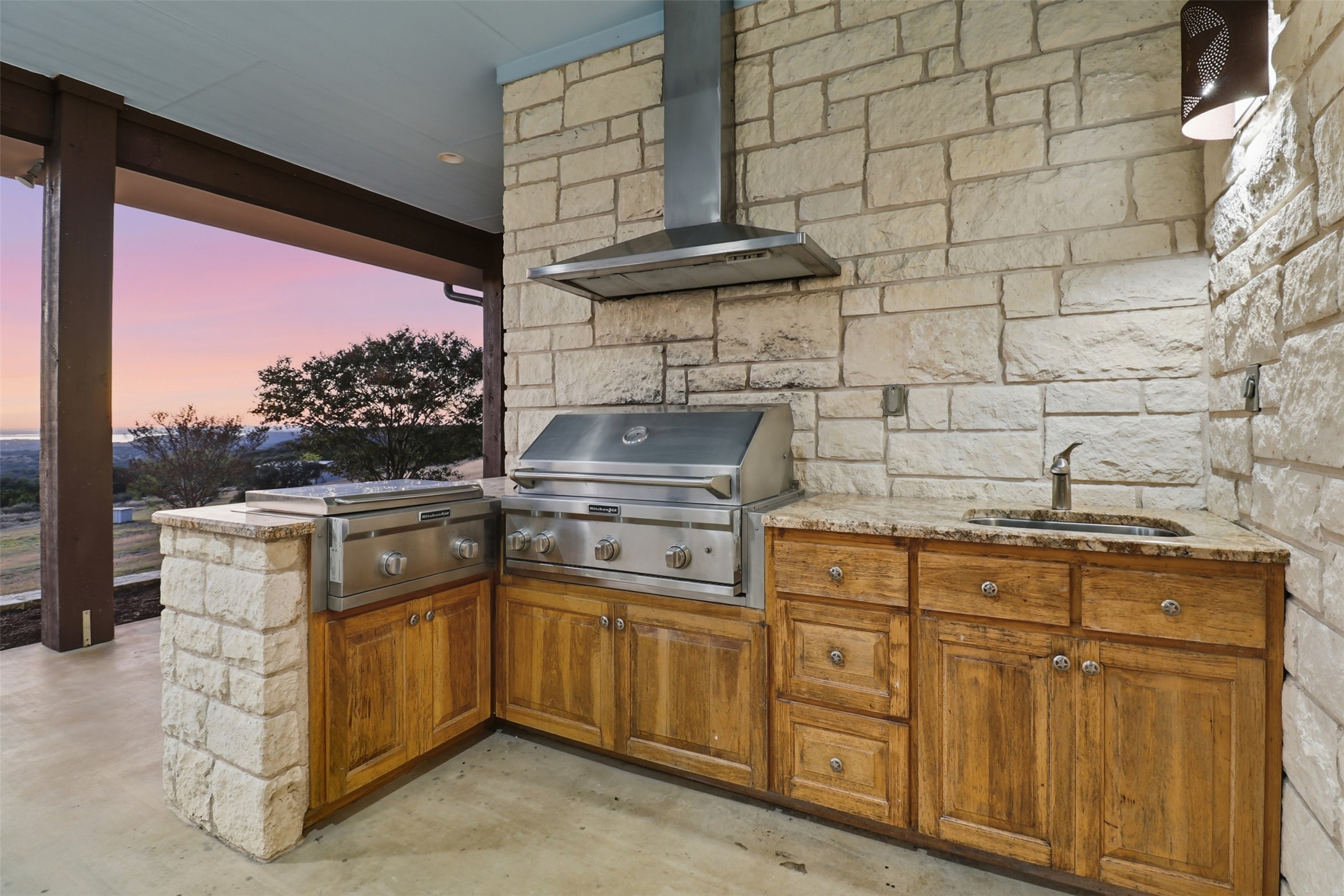 450 Threadgill Ranch Road Burnet, TX 78611 - Photo 24 of 33 a kitchen with stainless steel appliances granite countertop a stove a sink and dishwasher