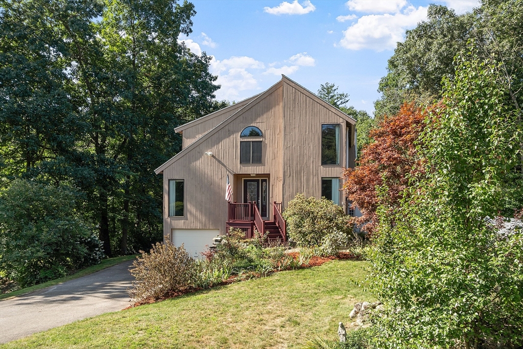 18 Lancaster Crossing Road Salem, NH 03079 - Photo 1 of 31 a house with trees in the background