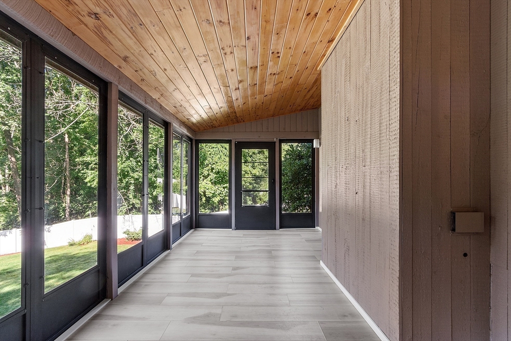18 Lancaster Crossing Road Salem, NH 03079 - Photo 14 of 31 a view of a porch with wooden floor and outdoor space