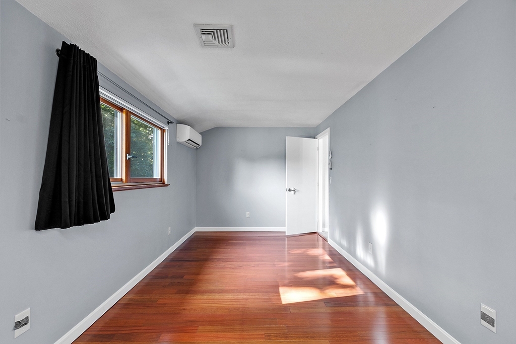 18 Lancaster Crossing Road Salem, NH 03079 - Photo 19 of 31 a view of an empty room with wooden floor and a window
