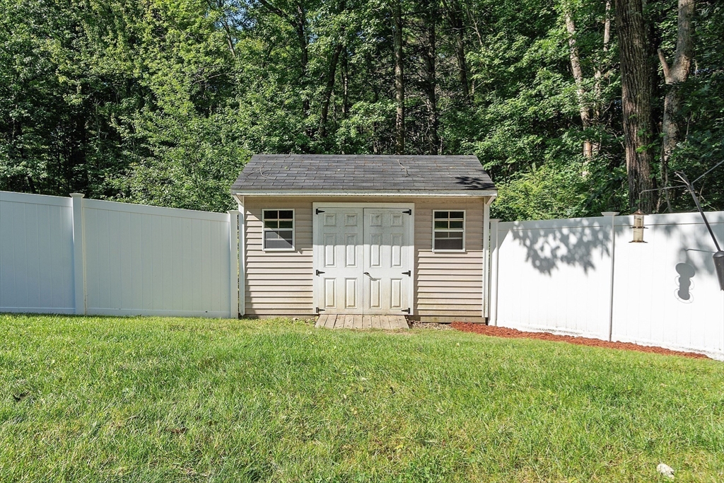 18 Lancaster Crossing Road Salem, NH 03079 - Photo 30 of 31 a house view with a garden space
