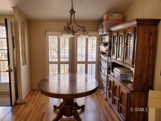 8926 Caliente Bodfish Road Caliente, CA 93518 - Photo 9 of 43 a dining room with furniture window and wooden floor