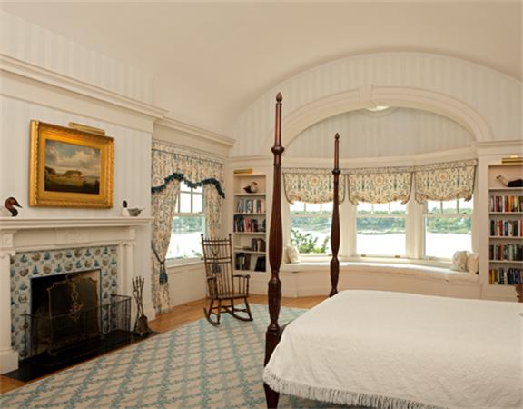 63 Nichols Road Cohasset, MA 02025 - Photo 13 of 22 a bedroom with a bed and a fireplace