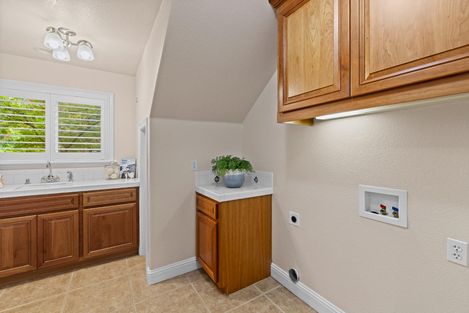 7396 Callison Road Penryn, CA 95663 - Photo 47 of 99 Laundry room downstairs by Primary Suite with laundry chute from upstairs.