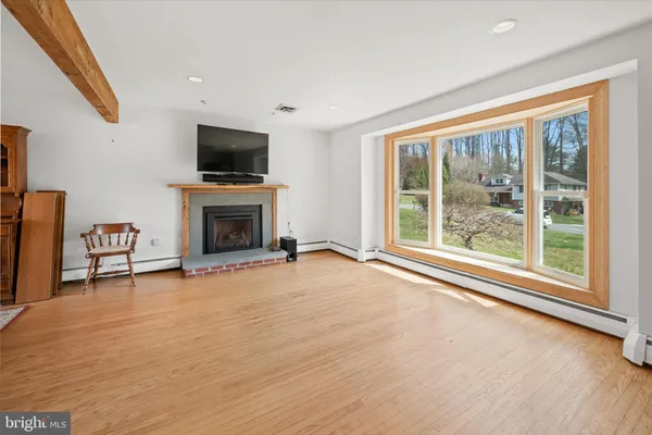 a view of livingroom with furniture flat screen tv and window