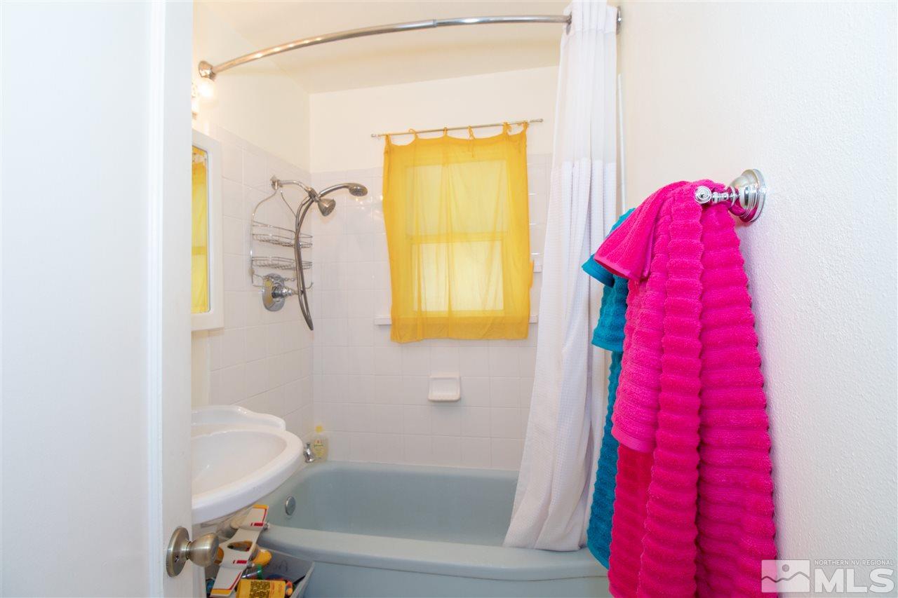 520 Claremont Street Reno, NV 89502 - Photo 11 of 22 a bathroom with a bathtub and a shower