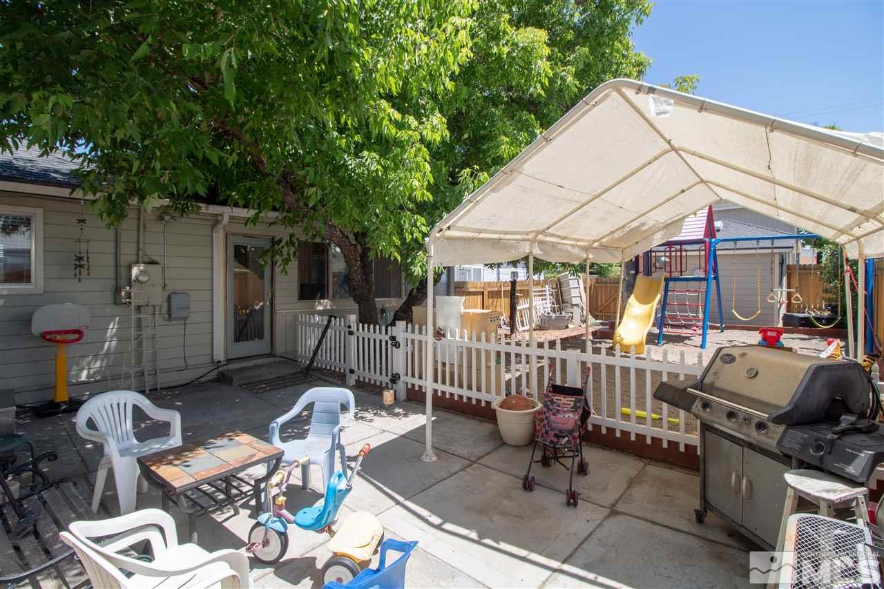520 Claremont Street Reno, NV 89502 - Photo 17 of 22 a view of a patio with table and chairs potted plants