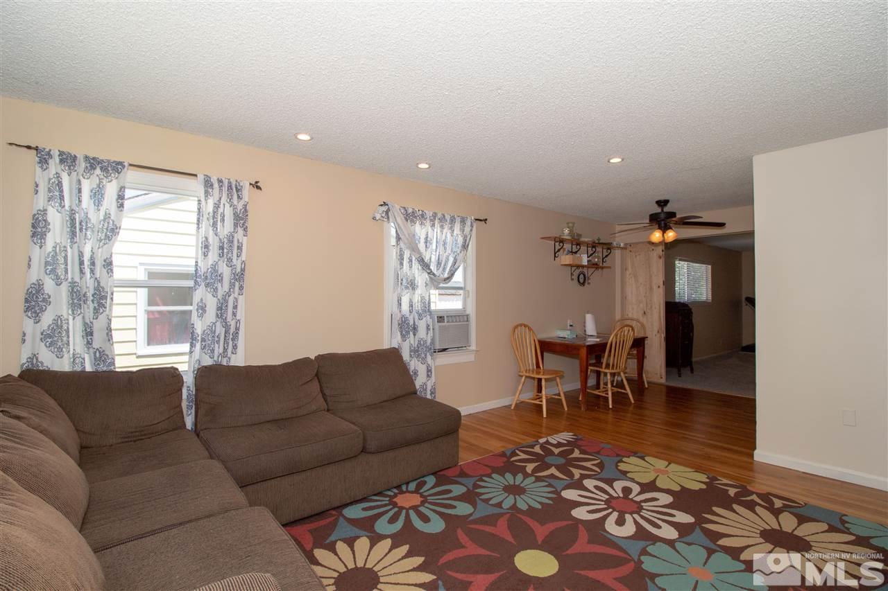 520 Claremont Street Reno, NV 89502 - Photo 4 of 22 a living room with furniture a dining table and a window