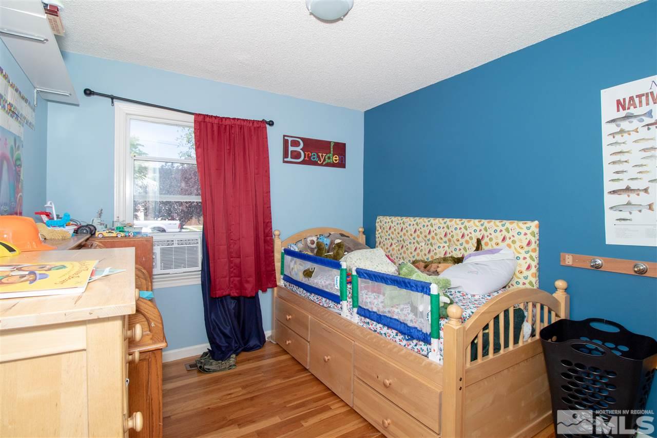 520 Claremont Street Reno, NV 89502 - Photo 10 of 22 a bedroom with furniture and a baby crib