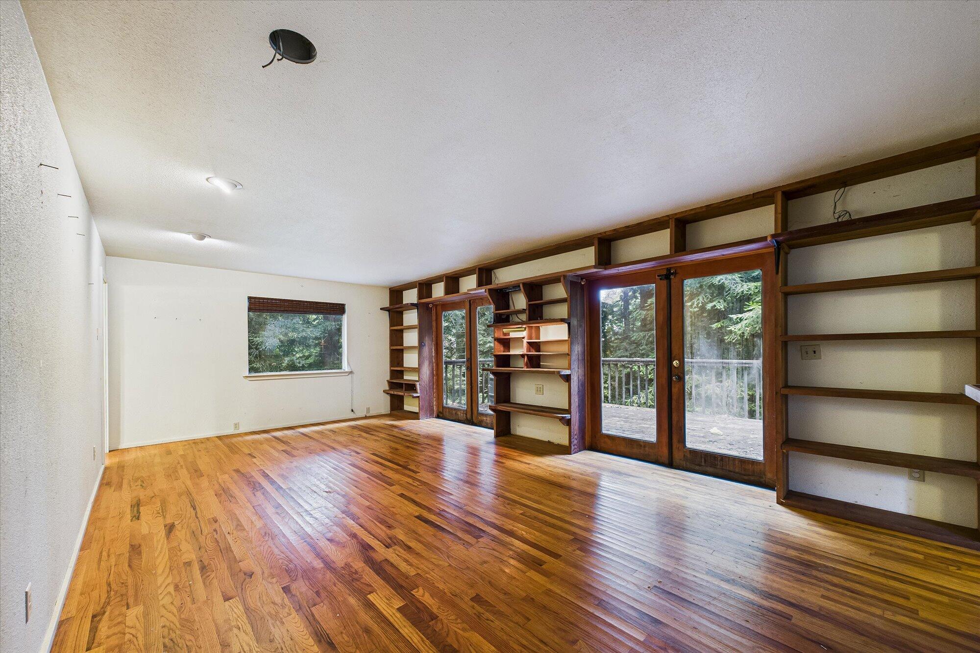 119 Sylva Street Arcata, CA 95521 - Photo 7 of 35 a big room with wooden floor and windows