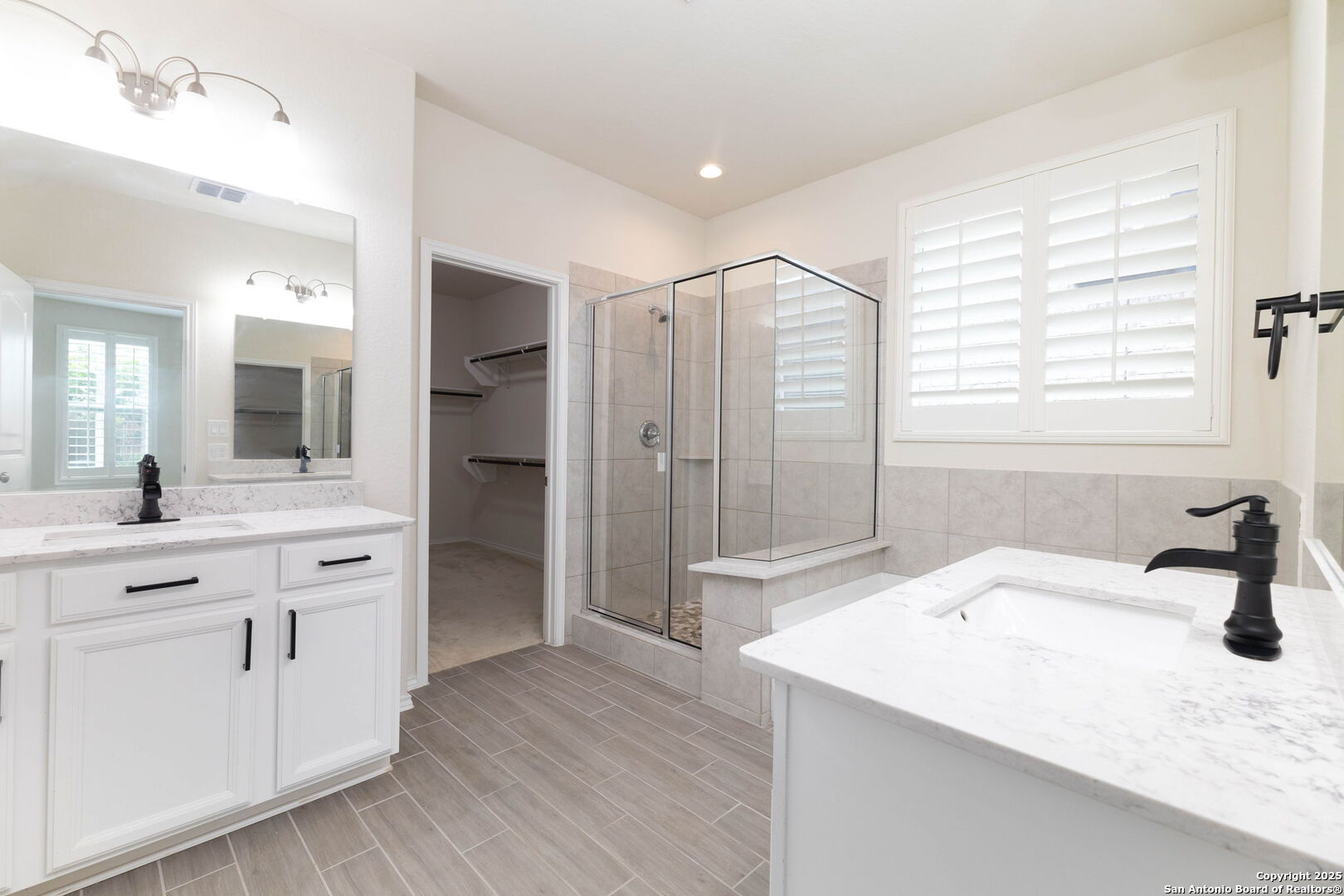 353 Aberdeen Boerne, TX 78015 - Photo 18 of 36 a spacious bathroom with a granite countertop sink shower and a mirror
