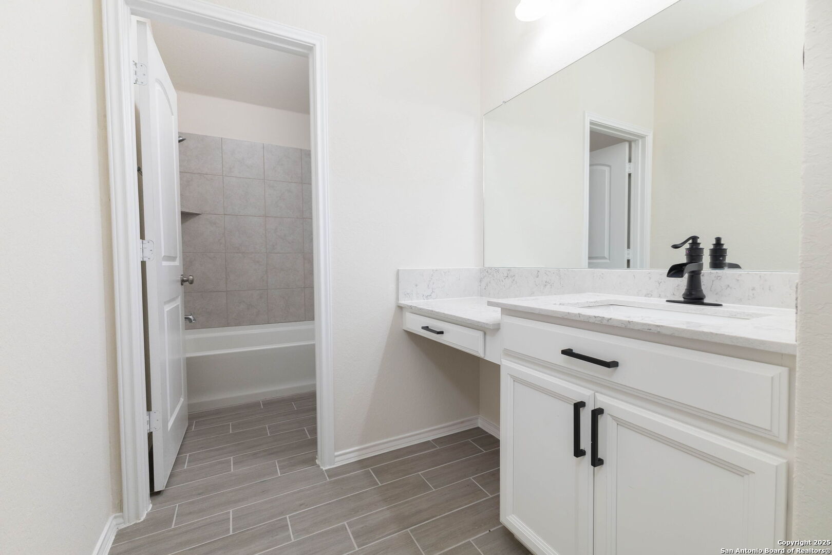 353 Aberdeen Boerne, TX 78015 - Photo 27 of 36 a bathroom with a sink and a mirror