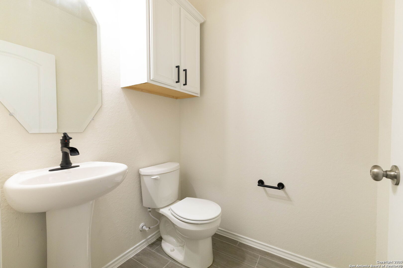 353 Aberdeen Boerne, TX 78015 - Photo 6 of 36 a bathroom with a toilet sink and mirror