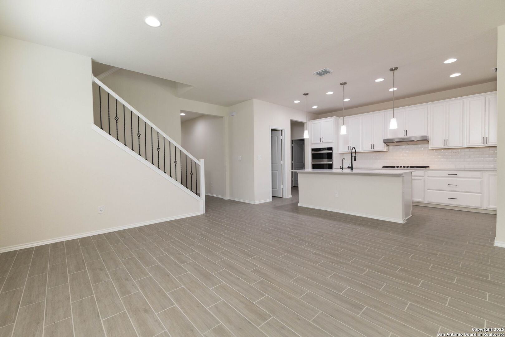 353 Aberdeen Boerne, TX 78015 - Photo 10 of 36 a view of kitchen with wooden floor and electronic appliances