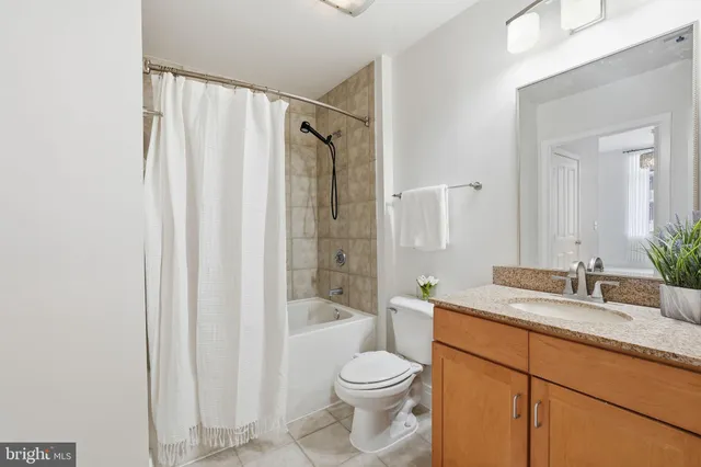 a view of a house with wooden deck and sitting area