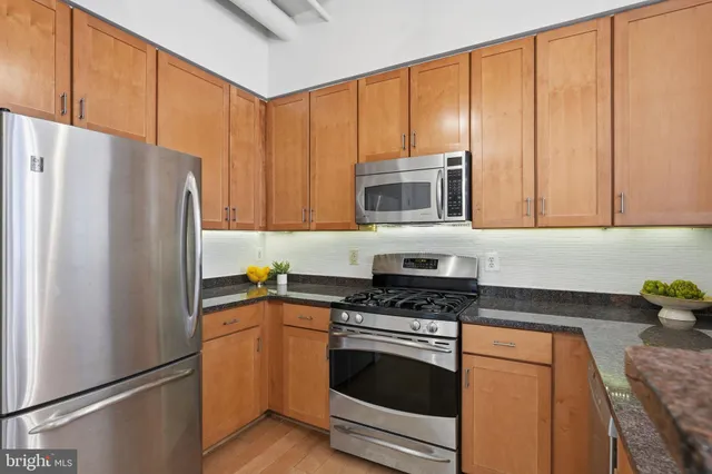 a view of a kitchen with a dishwasher and cabinets