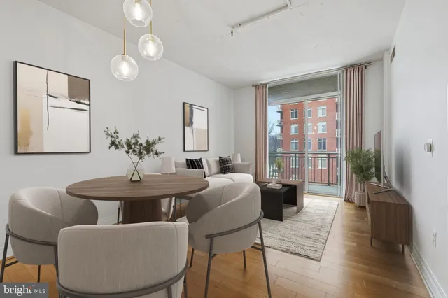 a view of a kitchen with a sink and a refrigerator