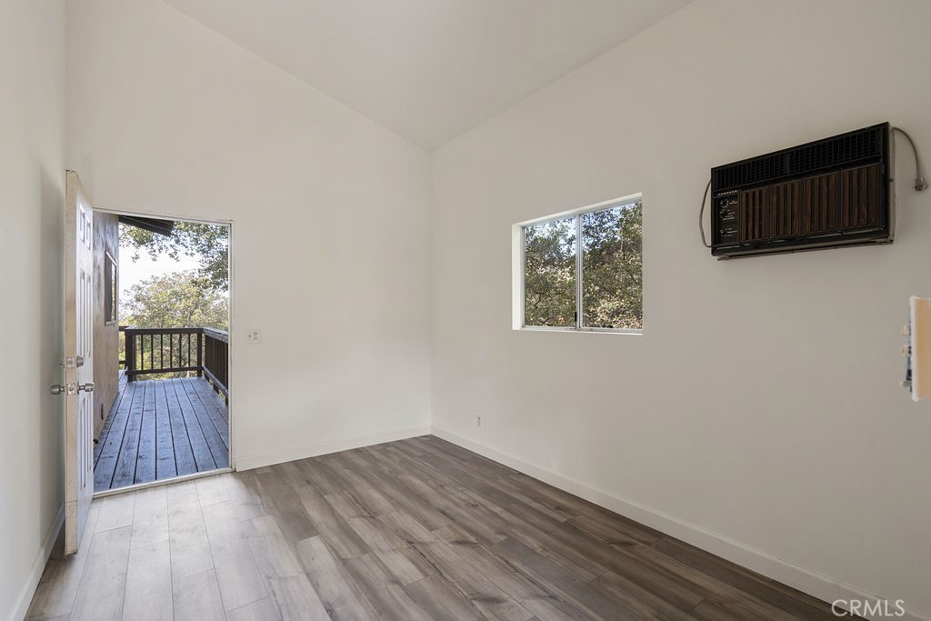 235 Spinks Canyon Road Duarte, CA 91010 - Photo 52 of 62 a view of an empty room with wooden floor and a window