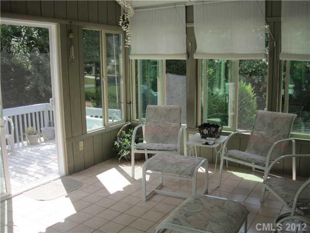 272 Spring Run Road Mooresville, NC 28117 - Photo 11 of 16 a view of a patio with a dining table and chairs