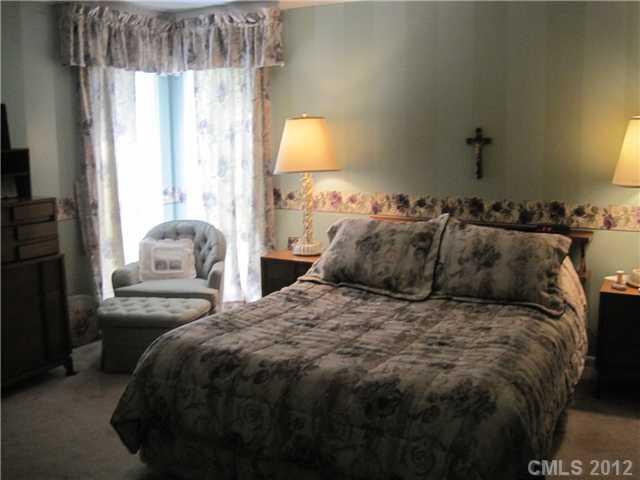 272 Spring Run Road Mooresville, NC 28117 - Photo 8 of 16 a bedroom with a bed and a window