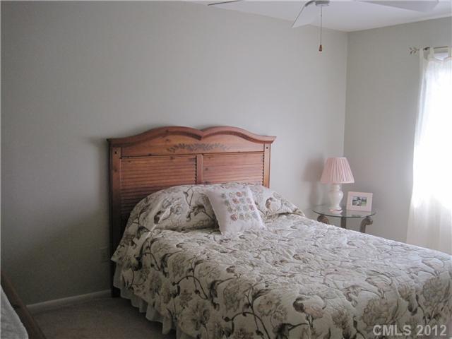 272 Spring Run Road Mooresville, NC 28117 - Photo 9 of 16 a bedroom with a bed and a window