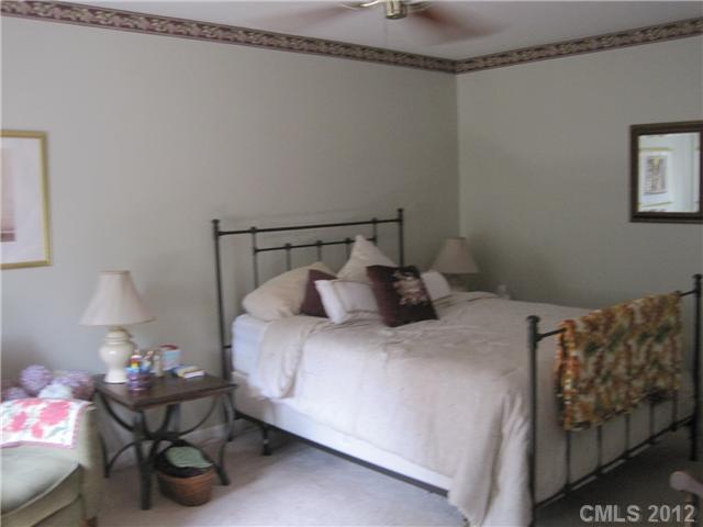 272 Spring Run Road Mooresville, NC 28117 - Photo 10 of 16 a bedroom with a bed and a couch