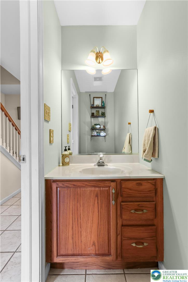 1712 9th Street Bethlehem, PA 18020 - Photo 17 of 38 a bathroom with a sink and a mirror