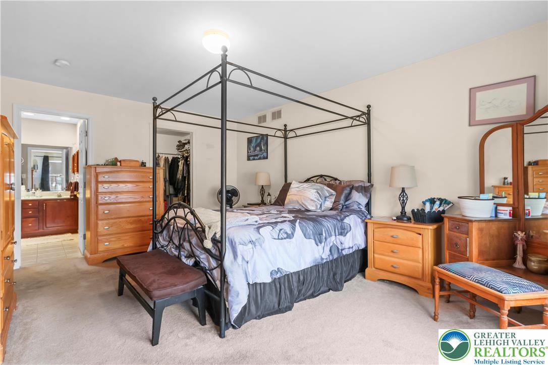 1712 9th Street Bethlehem, PA 18020 - Photo 19 of 38 a bedroom with furniture and a chandelier