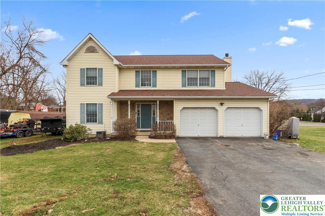1712 9th Street Bethlehem, PA 18020 - Photo 35 of 38 a front view of a house with a yard and garage