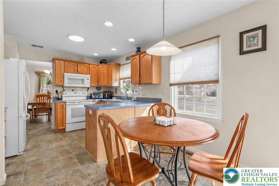 1712 9th Street Bethlehem, PA 18020 - Photo 9 of 38 a kitchen with a table chairs sink and cabinets