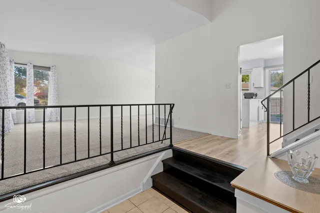 a view of a living room and wooden floor