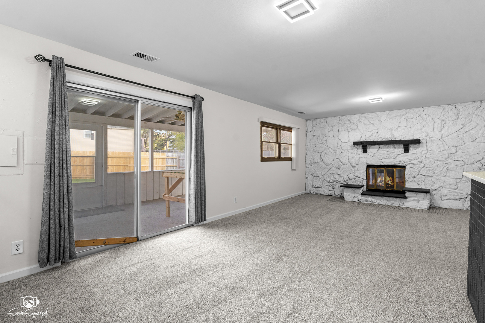 118 Camelot Way Bolingbrook, IL 60440 - Photo 12 of 32 an empty room with furniture and a fireplace
